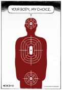 Human head & torso target from firing range saying, "your body, my choice," with additional target positioned over the figure's crotch.